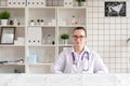 Portrait of a veterinarian in the office of the clinic for the clinic. Soft focus.