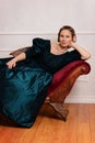 Portrait victorian woman leaning on fainting couch