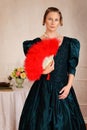Portrait victorian woman with red feather fan Royalty Free Stock Photo