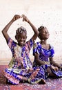 Portrait View of African ethnic group of children enjoying party indoors with confetti Royalty Free Stock Photo