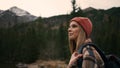 Portrait view of blonde woman tourist admiring of the mountain views, enjoying fresh air Royalty Free Stock Photo