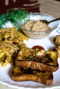 Portrait view of fried bread with tasty pasta, vegetable roll and sweet khir on a plate