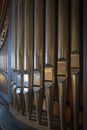Portrait view of a rank of shining steel pipes of a refurbished church organ Royalty Free Stock Photo