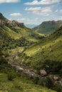 Portrait view of the river gorge, cliffs and mountain sides on the Thukela hike to the bottom of the Amphitheatre`s Tugela Falls