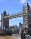 Portrait view of Tower Bridge, with the bridge partly elevated
