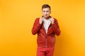 Portrait vogue confident handsome young man 25-30 years in red leather jacket, t-shirt stand isolated on bright trending Royalty Free Stock Photo