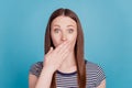 Portrait of voiceless crazy lady palm hide mouth on blue background