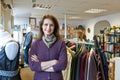 Portrait Of Volunteer Working In Charity Shop