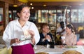 Portrait of waiter holding good tips