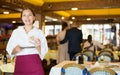 Portrait of waiter holding good tips