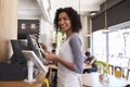 Portrait Of Waitress At Cash Register In Coffee Shop Royalty Free Stock Photo