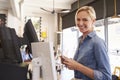 Portrait Of Waitress At Cash Register In Coffee Shop Royalty Free Stock Photo