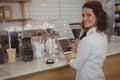 Portrait of waitress with digital tablet in cafe Royalty Free Stock Photo