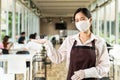 Portrait of waitress with facemask in New normal restaurant background