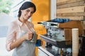 Portrait of waitress pouring coffee into cup Royalty Free Stock Photo