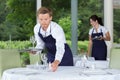 portrait waitress setting table