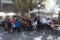 portrait of waitress and tourists at the cafe terrace in the street