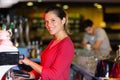 Portrait waitress using coffee machien