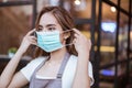 Waitress wearing a face mask at the coffee shop