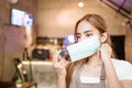 Waitress wearing a face mask at the coffee shop