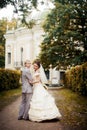 Portrait of walking newlyweds