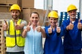 Portrait of warehouse manager and worker showing thumbs up Royalty Free Stock Photo