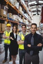 Portrait of warehouse manager and workers