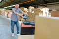 Portrait warehouse worker carrying boxes Royalty Free Stock Photo
