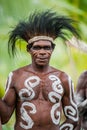 Portrait of a Warrior Asmat tribe in traditional headdress.