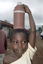 Portrait of water carrying Ghanaian young girl