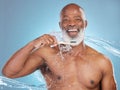 Portrait, water splash and black man with toothbrush, toothpaste or dental hygiene for wellness, brushing and blue Royalty Free Stock Photo