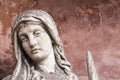 Portrait of a weathered sculpture of maria