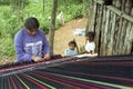 Portrait of weaving Indian woman with children Royalty Free Stock Photo