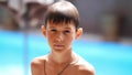 Portrait wet serious boy after a swimming pool looks at the camera, close-up Royalty Free Stock Photo