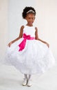 African american girl posing for the camera wearing a white party dress