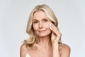 Portrait of woman holding cotton pad doing everyday routine makeup removing.