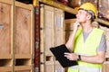 Portrait white caucasian worker with clipboard in distribution warehouse Royalty Free Stock Photo