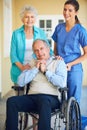 Portrait of wife, caregiver or old man in wheelchair in hospital clinic helping an elderly patient for support. Happy Royalty Free Stock Photo