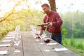 Portrait of wine producer pouring red wine