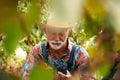 Portrait of winegrower in the greenery of the vine