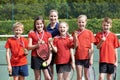 Portrait Of Winning School Tennis Team With Medals