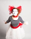 Portrait of the woman as mime sending a kiss. Concept of love and April Fools Day.