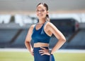Portrait, woman and athlete on stadium running track for sports race, arena and outdoor competition. Happy young runner Royalty Free Stock Photo
