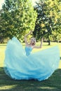 Woman ballet dancer dancing in park Royalty Free Stock Photo