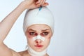 portrait of a woman bandaged face the syringe sticks out in the head isolated background