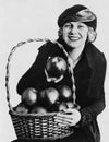 Portrait of woman with basket of apples Royalty Free Stock Photo