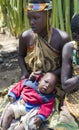 Portrait woman in bead decoration with a baby of the Hadzabe tribe