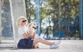 Portrait of a woman with beautiful dog playing outdoors. Royalty Free Stock Photo