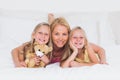 Portrait of woman in bed with her children Royalty Free Stock Photo