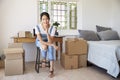 Portrait Of Woman In Bedroom Running Business From Home